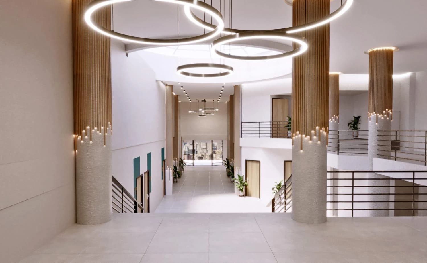 Hall à double hauteur, mezzanine et suspensions lumineuses en anneaux